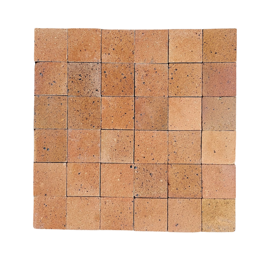 A grid of 36 Atelier Clay 2x2 Mosaic Natural Stone tiles, in brownish-orange tones, arranged in six rows and six columns and isolated on a white background.