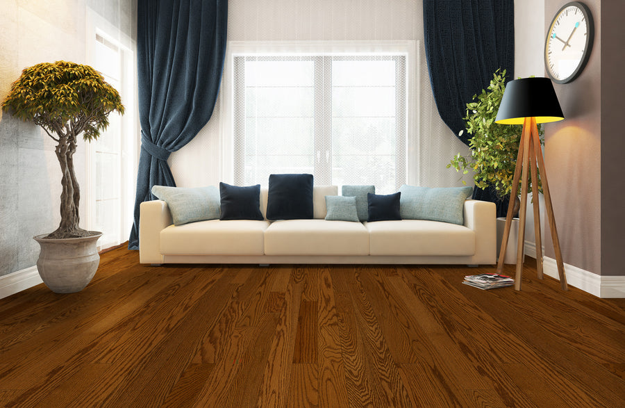 Modern living room with a white sofa, blue and black cushions, dark blue curtains, wooden floors, a potted tree, a tripod floor lamp, and a wall clock, with large windows letting in natural light.