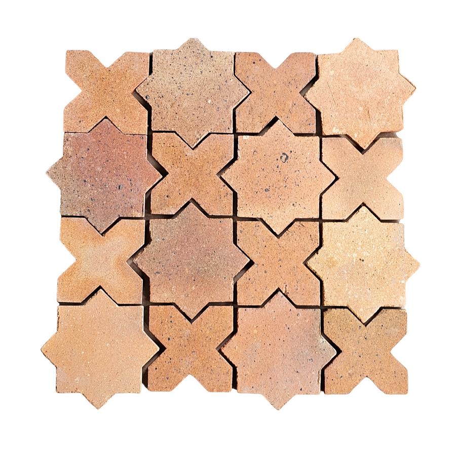 A grid of interlocking, star-shaped Atelier Clay XOXO Mosaic Natural Stone tiles in earthy tones, arranged closely together on a white background.