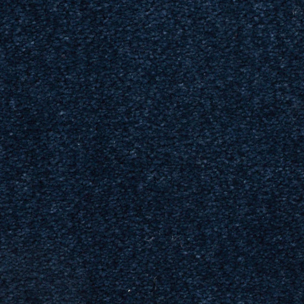 Close-up of Seduction On Trend Carpet in Regatta color, featuring a dark blue, textured surface with visible fibers that brings comfort and stylish appeal to any space.