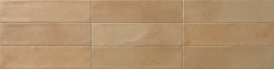 Relic 2.7 x 11 Porcelain Tile, rectangular and beige with a smooth matte finish, is arranged in two rows by four columns. Subtle shade variation and slight texture differences create a refined look.