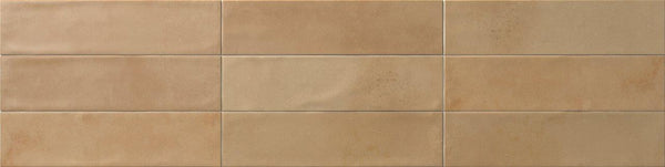 Relic 2.7 x 11 Porcelain Tile, rectangular and beige with a smooth matte finish, is arranged in two rows by four columns. Subtle shade variation and slight texture differences create a refined look.