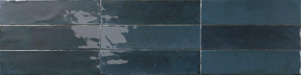 Six glossy dark blue Relic 2.7 x 11 Porcelain Tiles, featuring slight shade variation and reflective patches, arranged in two rows of three tiles each.