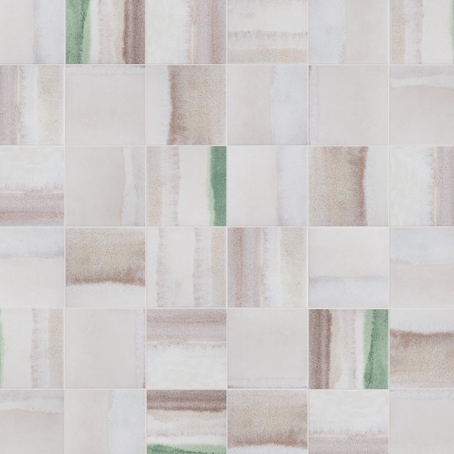A grid of square ceramic tiles with a soft, abstract pattern in muted beige, brown, white, and occasional green vertical and horizontal streaks. The design gives a subtle watercolor effect.