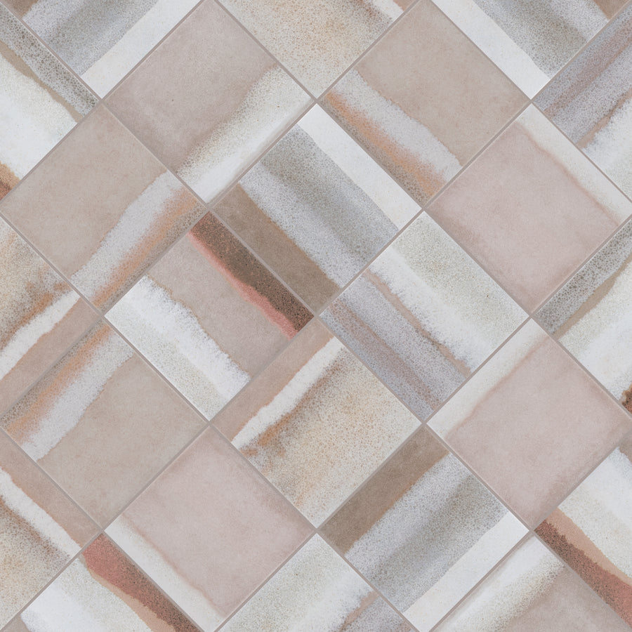 A close-up of ceramic tiles arranged in a diagonal checkerboard pattern, featuring beige, brown, and gray tones with varied, streaky textures on each tile.