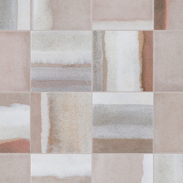 A close-up of ceramic tiles with a mix of soft, earthy tones in beige, brown, gray, and white, featuring abstract, weathered patterns and varied textures on each square.