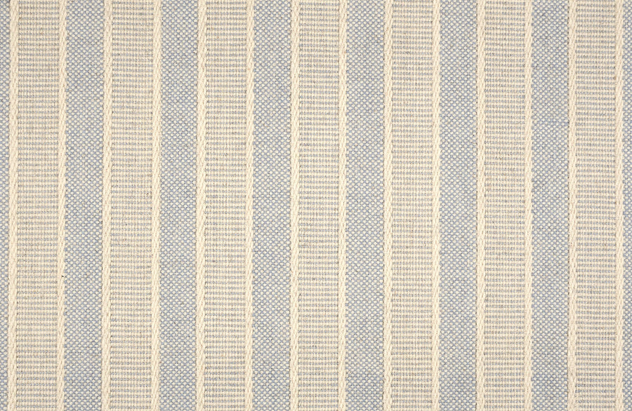 A woven fabric with vertical stripes in alternating beige and light gray, ideal for anyone seeking the modern look of Renegade Stripe On Trend Carpet.