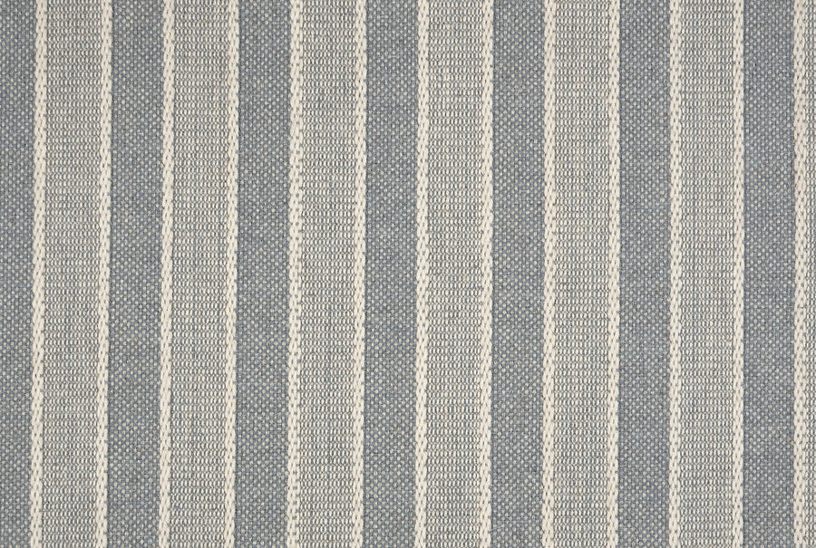 Inspired by the Renegade Stripe On Trend Carpet, this fabric pattern features vertical beige stripes on a muted gray background. The woven texture offers a subtle, classic look with contemporary appeal.