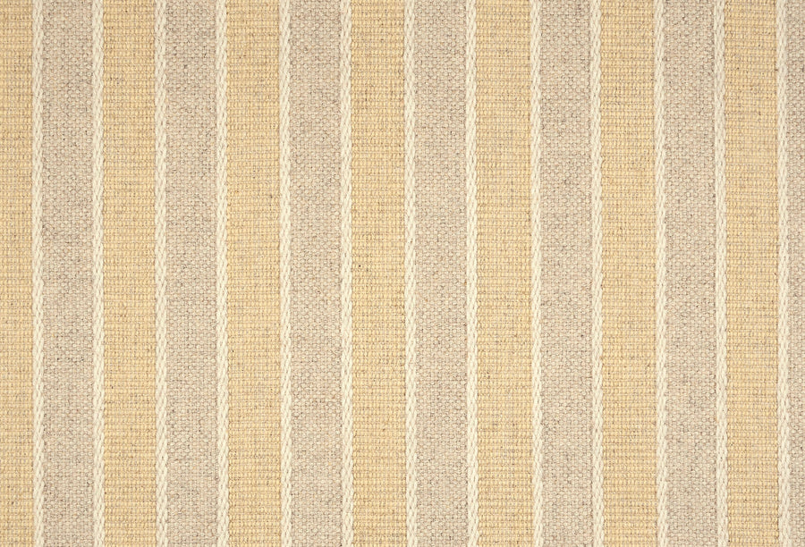 The Renegade Stripe On Trend Carpet showcases a woven texture and alternating beige and light tan vertical stripes, adding luxury and durability to contemporary spaces.