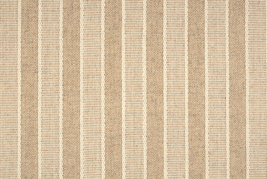 Renegade Stripe On Trend Carpet offers beige and tan textured fabric with alternating vertical stripes, featuring a woven look and subtle pattern—ideal for a contemporary, luxurious, and durable carpet design.