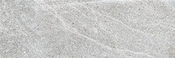 A close-up view of a light gray, textured stone surface with subtle white veining and fine natural patterns.