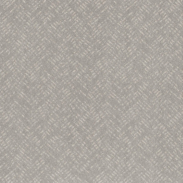 Favoured Path Pet Friendly in Rock Crystal features a light grey textured surface with a subtle diagonal herringbone pattern, creating a soft, woven look. This contemporary flooring is ideal for commercial spaces, offering consistent and sophisticated style.