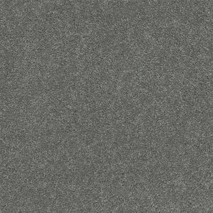 Close-up of Rock Solid III Family Friendly Carpet in Armor—gray, textured surface with dense, soft feel and subtle mottling, perfect for creating a welcoming family space.