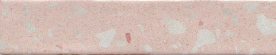 A close-up of a pink bologna slice with white specks and a smooth, processed texture, resembling the Fragmento 2x10 Ceramic Tile in Rose All Day, with its terrazzo-look and bold graphic pattern.