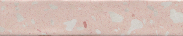 A close-up of a pink bologna slice with white specks and a smooth, processed texture, resembling the Fragmento 2x10 Ceramic Tile in Rose All Day, with its terrazzo-look and bold graphic pattern.