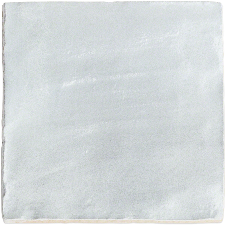 The Myorka 4" x 4" ceramic tile in blue features a slightly uneven, textured surface and rough edges for a handmade look—ideal for creating an eye-catching kitchen backsplash.