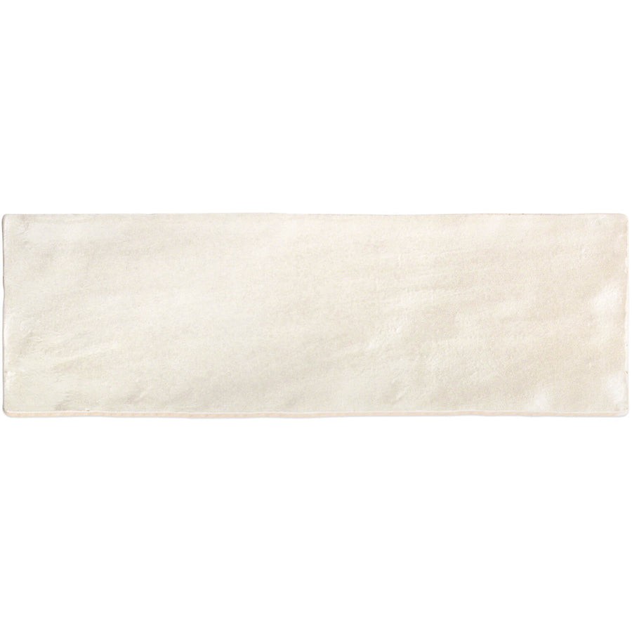 The Myorka 2" x 8" Subway Tile in cream is perfect for adding warmth to an accent wall or complementing a modern kitchen backsplash. Shown on a white background.