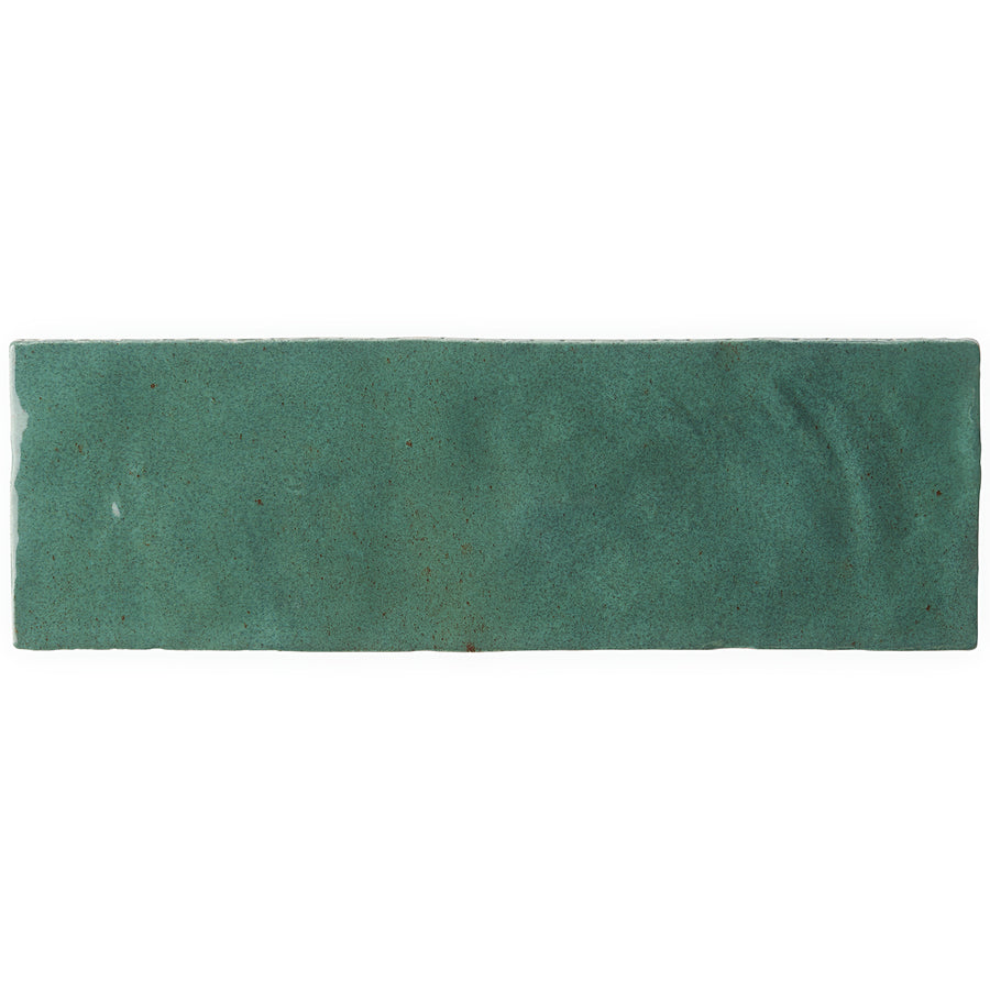 A rectangular, green Serena 3" x 8" Subway Tile with a subtly uneven surface and edges, perfect for accent walls or floors, shown on a white background.