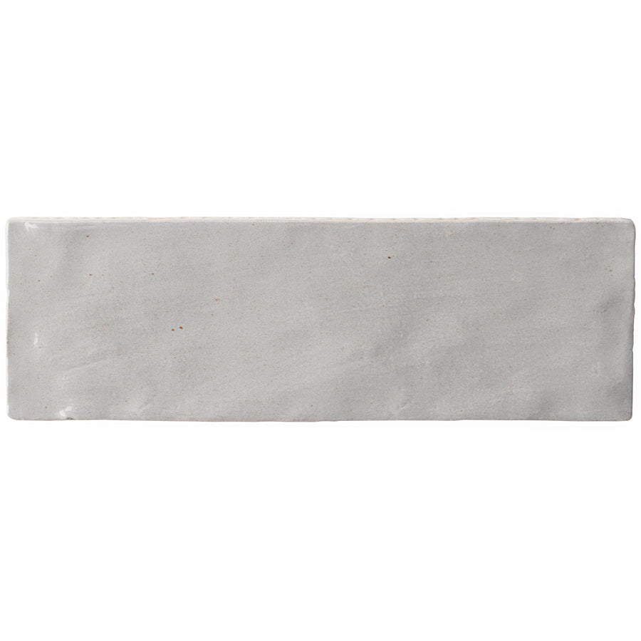 The Serena 3" x 8" Subway Tile in grey features a rectangular shape with a subtle, lightly textured surface, ideal for accent walls or floors, shown front-facing against a white background.