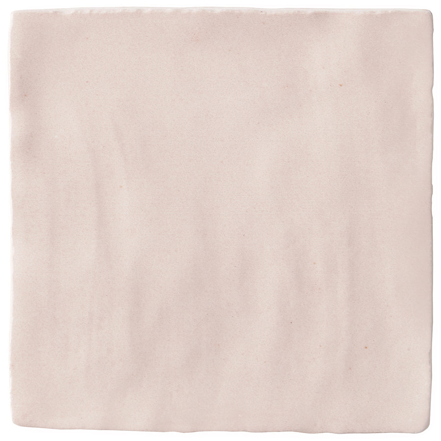 The Serena 4" x 4" Ceramic Tile in Pink features a soft matte finish, handcrafted edges, and a subtle texture—ideal for backsplashes or accent walls.