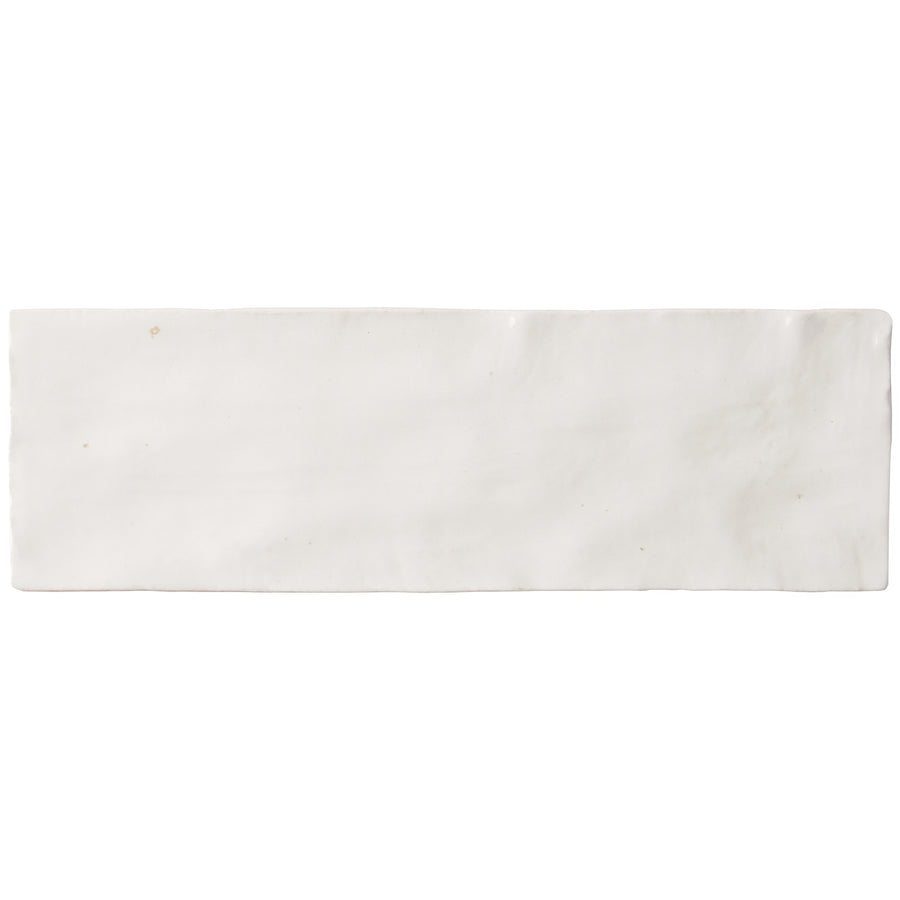A rectangular Serena 3" x 8" Subway Tile in white with a subtly textured, slightly uneven surface is shown from above against a plain white background—perfect for accent walls or flooring.