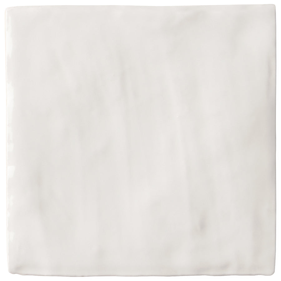 The Serena 4" x 4" Ceramic Tile in white features a glossy finish with subtle marble-like streaks, ideal for backsplashes or accent walls.