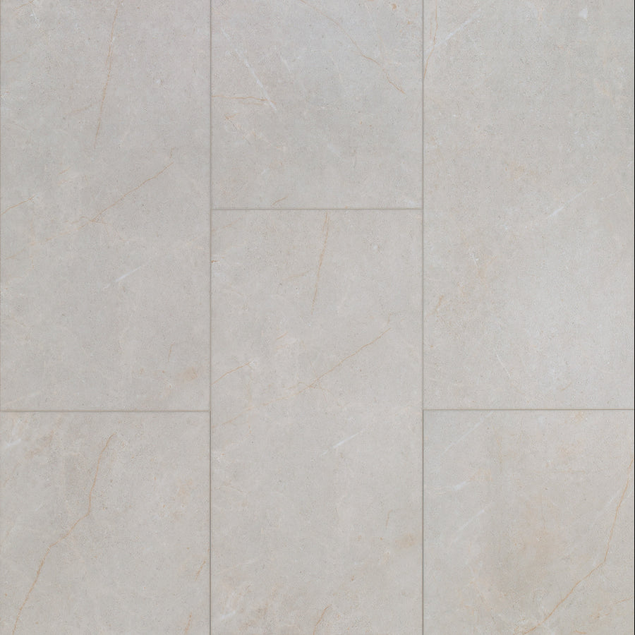 Close-up of Coretec CT Plus Tile Luxury Vinyl Tile in light gray with subtle beige veining, arranged in a staggered brick pattern. The smooth matte finish mimics stone, offering stylish and durable luxury vinyl flooring.