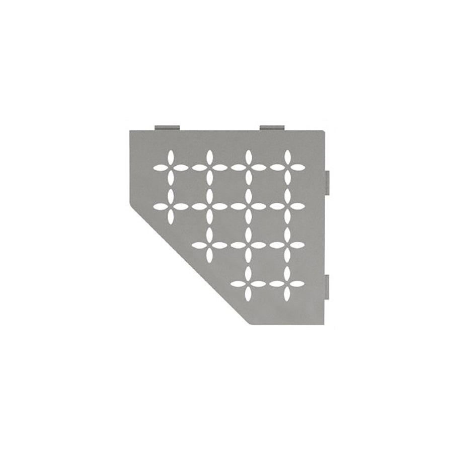 A gray, triangular Schluter Shelves metal panel features rounded cut-out flower patterns in a grid. It has three tabs on the top edge and one diagonal side—perfect for shower organization. The background is plain white.
