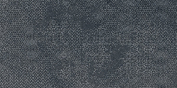 Shyft 24x48 Lace Deco features a dark gray porcelain tile with a subtle, intricate geometric pattern resembling small floral motifs, inspired by vintage wallpaper and classic Brazilian slate. This rectified tile brings timeless elegance to any space.