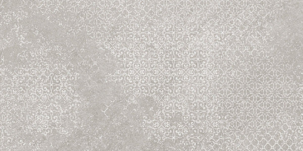 Shyft 12x24 Lace Deco features a textured surface with a subtle, ornate white floral and geometric pattern on light gray, delivering a vintage, decorative look inspired by Brazilian slate in rectified porcelain.