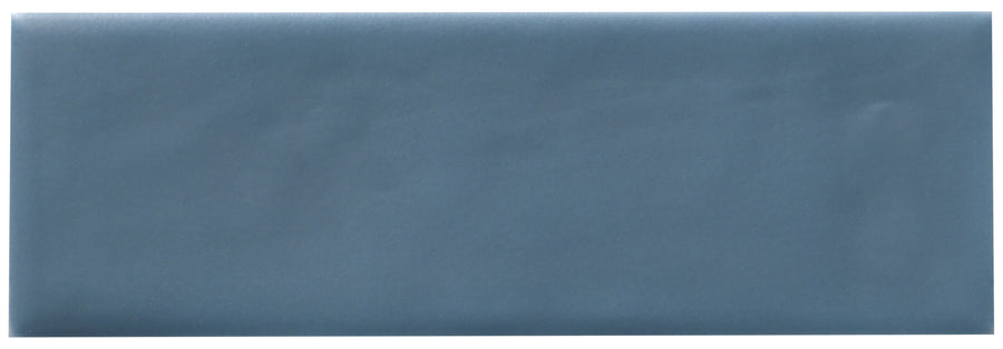 The Zephyr 2x6 Ceramic Tile, a plain rectangular blue tile with a handcrafted luxury and Mediterranean elegance, is shown against a white background.