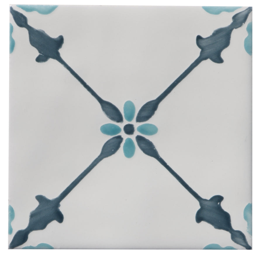 The Zephyr 4x4 Merida Deco Ceramic Tile features a white ceramic base with a symmetrical Mediterranean pattern of dark blue X-shaped lines and light blue ovals, bringing handcrafted luxury to any room.