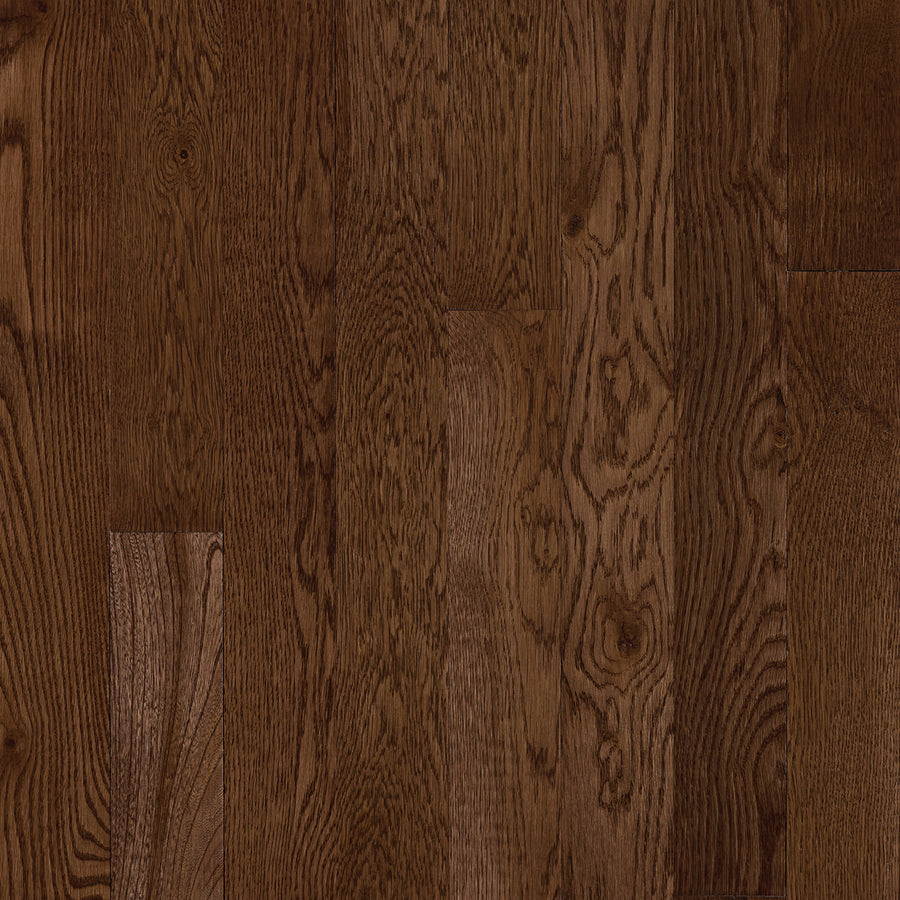 Close-up of St. Vincent 3 1/4" Hardwood in White Oak Saddle, showcasing dark brown floorboards with natural grain patterns and knots arranged neatly for a rich, textured look.