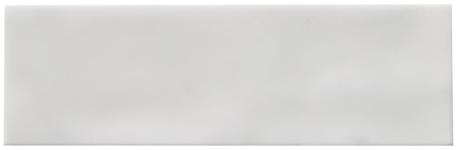 The Zephyr 2.5x8 Ceramic Tile features a smooth, glossy white surface with a plain, rectangular shape and no visible patterns. Inspired by Mediterranean design, this tile is available by special order.