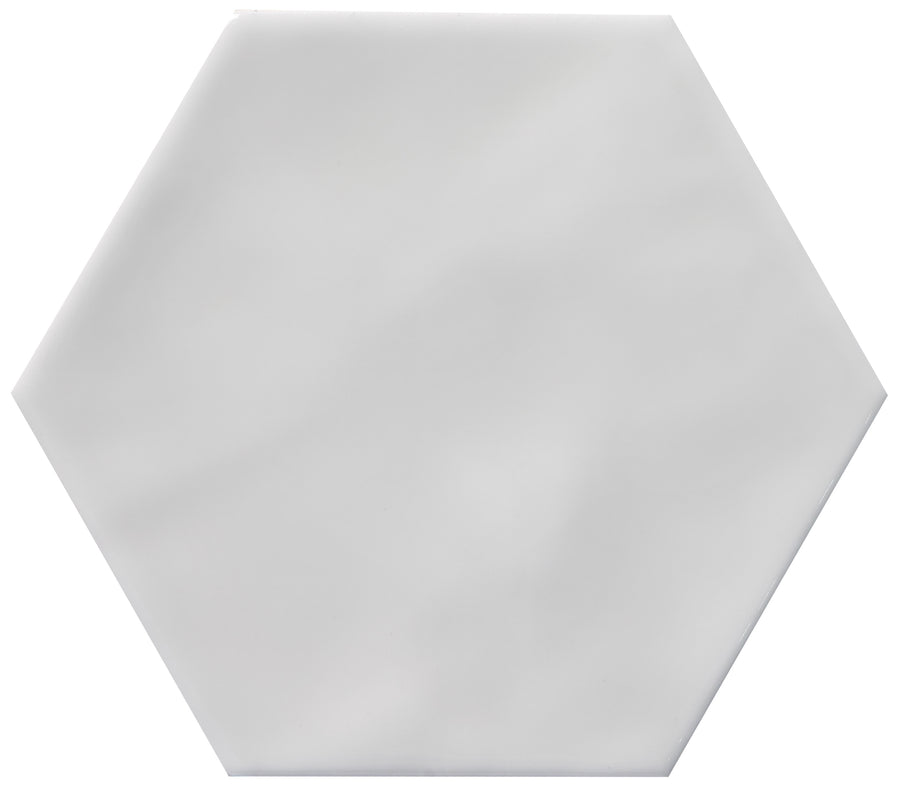 The Zephyr 4.2x4.9 Hexagon Ceramic Tile features a plain white finish and smooth hexagonal edges, shown against a white background.