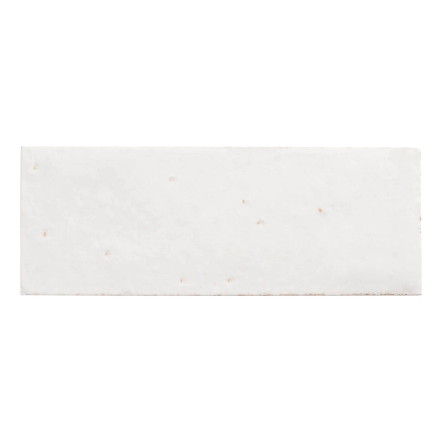 A rectangular, white Arden Sarmento 3" x 8" Subway Porcelain Tile with a smooth surface and small brown specks is shown from above on a plain white background, evoking the crisp look of premium porcelain.