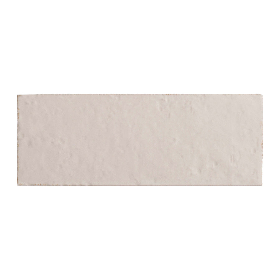 The Sarmento 3" x 8" Subway Porcelain Tile in Perpetual features a rectangular, elongated design with a slightly textured surface, displayed against a plain white background.