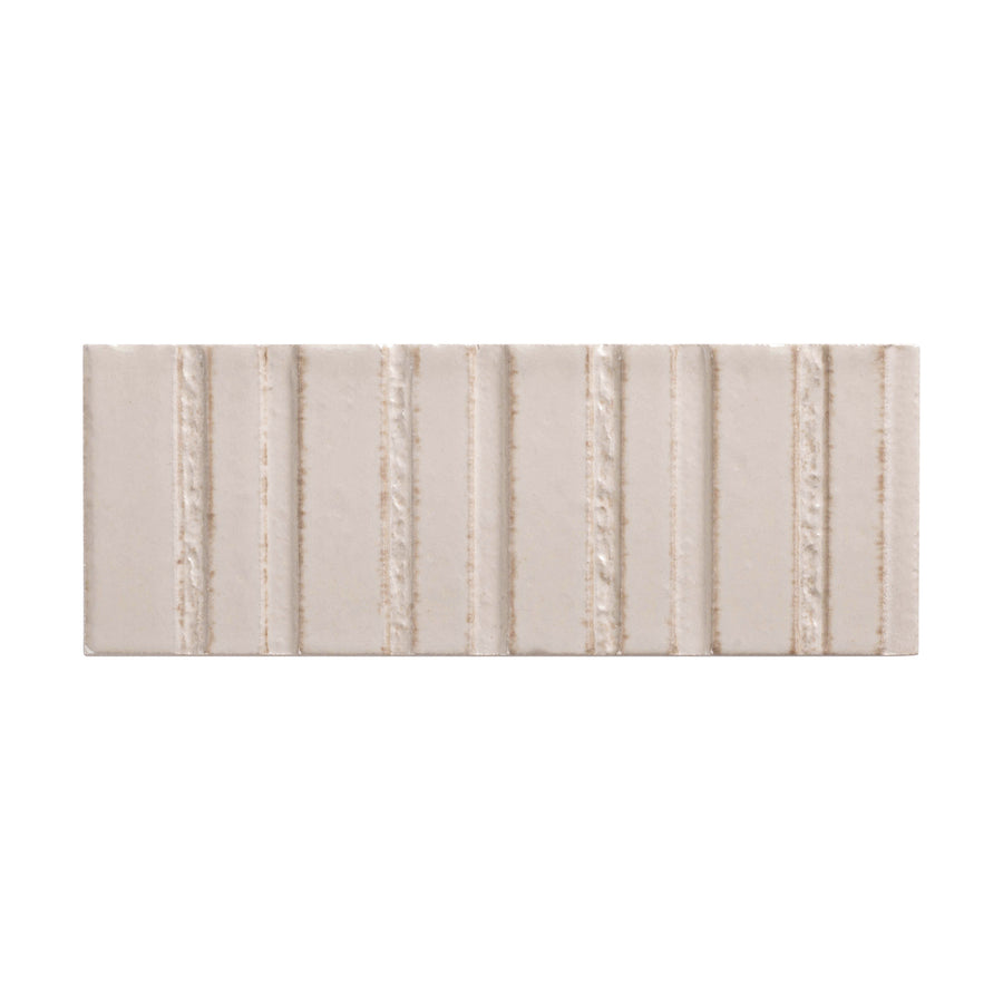 The Sarmento 3" x 8" Deco Subway Porcelain Tile in Perpetual features a matte finish and linear raised and flat vertical stripes for a textured look on a white background.