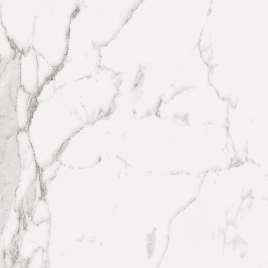 White marble surface with subtle gray veining throughout, creating an elegant and natural stone pattern. The overall appearance is smooth, clean, and sophisticated, suitable for backgrounds or decorative use.