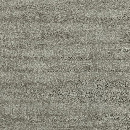 Close-up of Cirrus Berber Carpet in Sage, featuring a soft, textured surface with subtle horizontal wavy patterns and a lightly mottled appearance.