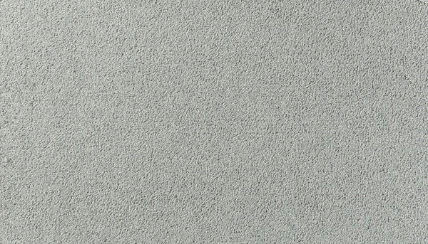 A close-up of Salinas Valley II Pet Friendly Carpet in Ridgeline shows its light gray, textured surface with even fibers and a soft, plush look—an ideal, luxurious flooring choice for sophisticated, high-traffic areas.