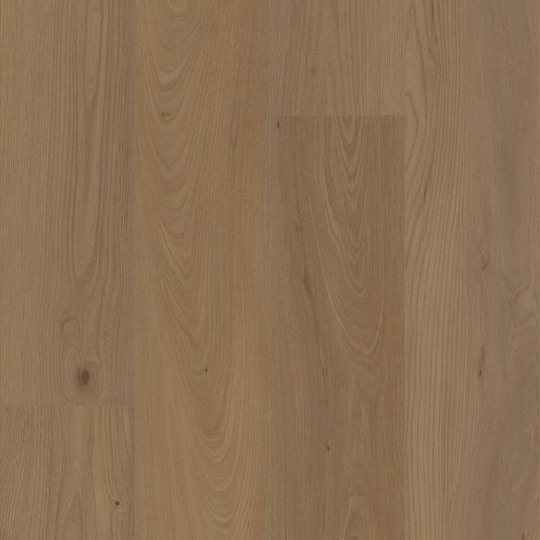 Close-up of Coretec Pro Plus XL Enhanced Vinyl flooring with light to medium brown planks, showcasing natural wood grain and knots for texture. Enjoy durable, waterproof flooring with authentic wood and stone looks.