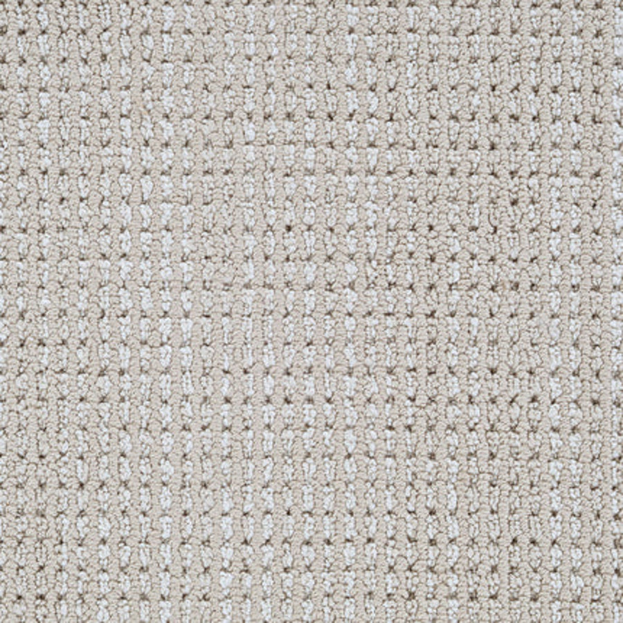 Close-up view of Top Notch Berber Carpet in Sand Castle, showcasing its grid-like woven texture with raised and recessed areas for a subtle checkered look; this premium flooring is also highly stain resistant.