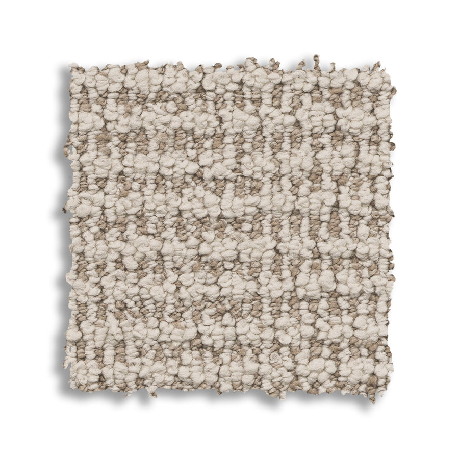 A square swatch of Laine On Trend Carpet showcases a soft, chunky texture in neutral beige and light brown tones, offering a premium, stylish look against a white background.