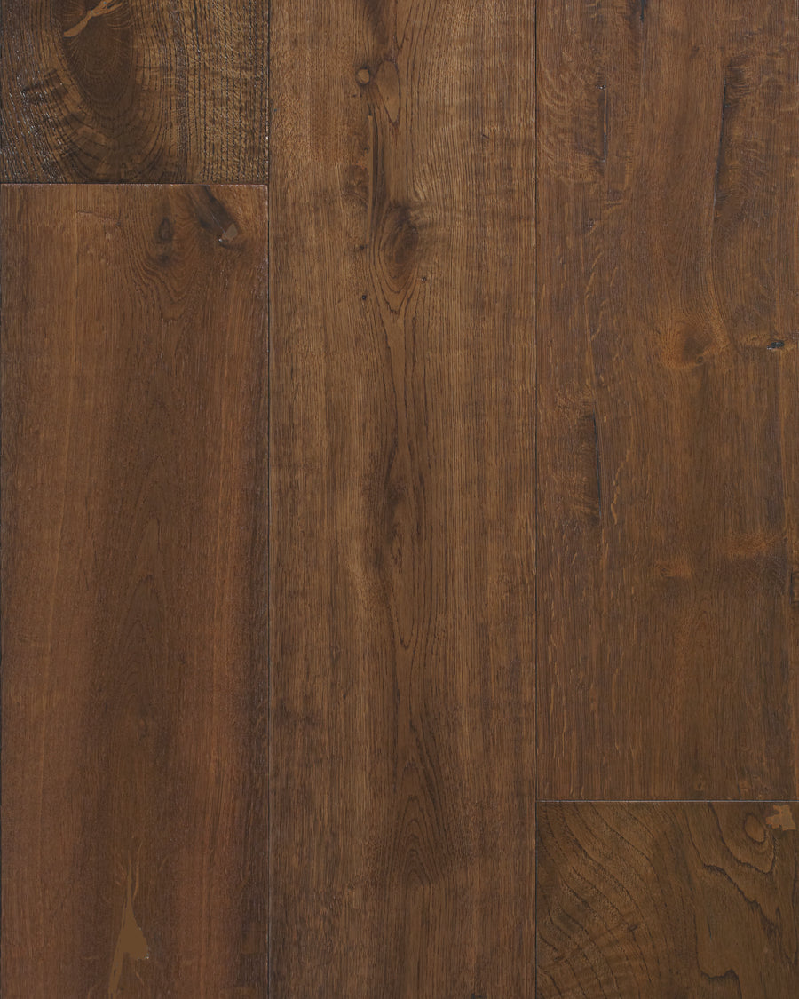 Close-up view of Villa Borghese 8" French Oak floorboards in Scipone—dark brown planks with visible wood grain and knots, rich natural texture, subtle color variation, and scratch-resistant ultra low gloss urethane finish.