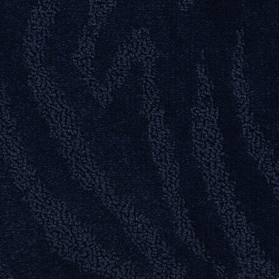 Capetown On Trend Carpet in Sea Point color features dark blue textured fabric with wavy, raised patterns. This plush carpet blends style and comfort, making it ideal for adding luxury and durability to high-traffic areas.