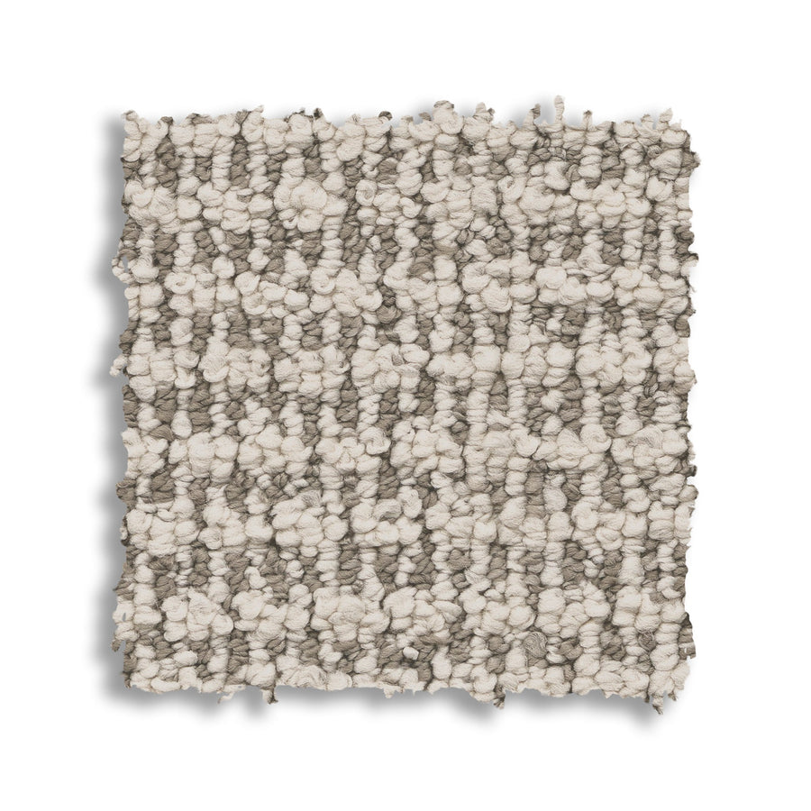 A square swatch of Laine On Trend Carpet, shown on a white background, displays looped light beige and gray tones—perfect for adding luxurious style to any space.