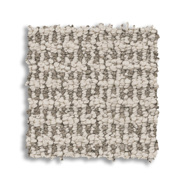 A square swatch of Laine On Trend Carpet, shown on a white background, displays looped light beige and gray tones—perfect for adding luxurious style to any space.