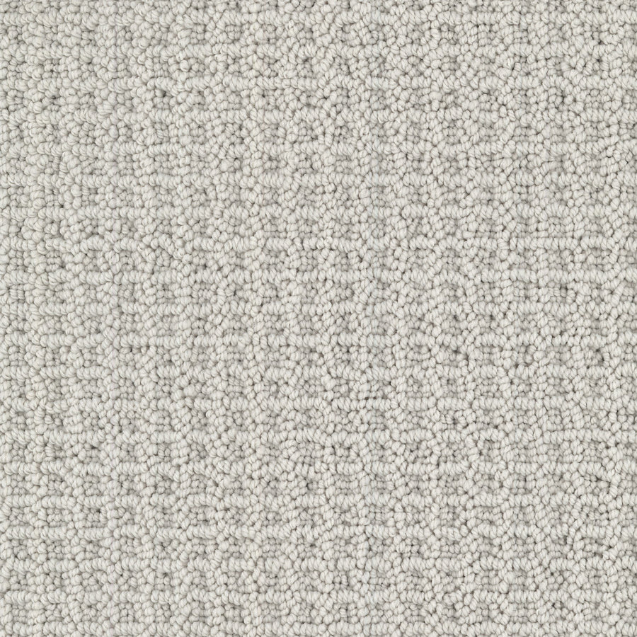 Close-up of Seascape Berber Carpet in light gray, featuring a uniform, tightly woven loop pile. The small, consistent loops create a soft yet structured texture for a modern look.