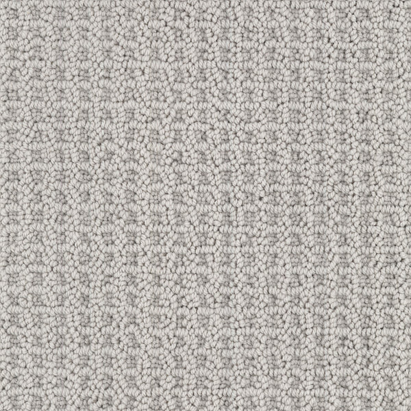 Close-up of Seascape Berber Carpet in light gray, featuring tightly looped fibers for a uniform and soft look. The consistent pattern showcases the detailed weave and stylish appeal of this carpet.